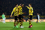 Pierre-Emerick Aubameyang of Borussia Dortmund celebrates with team mates as he scores the third goal during the Bundesliga match between Borussia Dortmund